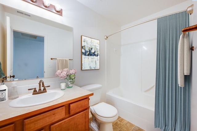 full bathroom featuring shower / bathtub combination, vanity, and toilet