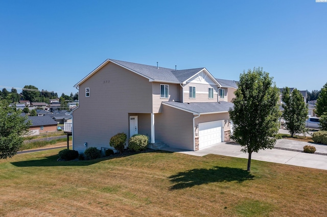 view of front of house featuring a garage and a front yard