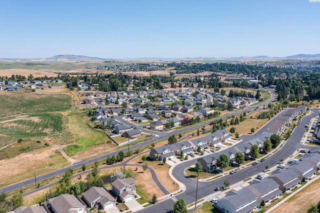 birds eye view of property featuring a mountain view