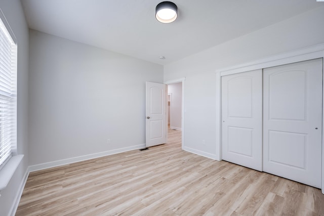 1390 SW Panorama Dr, Pullman, WA 99163 - unfurnished bedroom with light wood finished floors, a closet, and baseboards