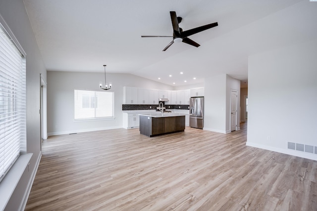 1390 SW Panorama Dr, Pullman, WA 99163 - kitchen featuring stainless steel fridge with ice dispenser, open floor plan, a chandelier, a sink, and light countertops