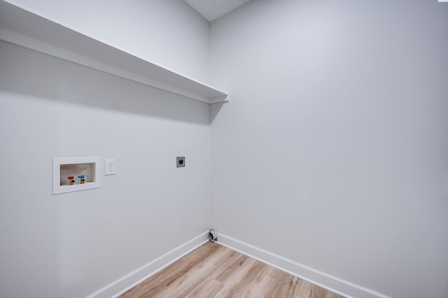 1390 SW Panorama Dr, Pullman, WA 99163 - laundry area featuring baseboards, light wood-style floors, washer hookup, and hookup for an electric dryer