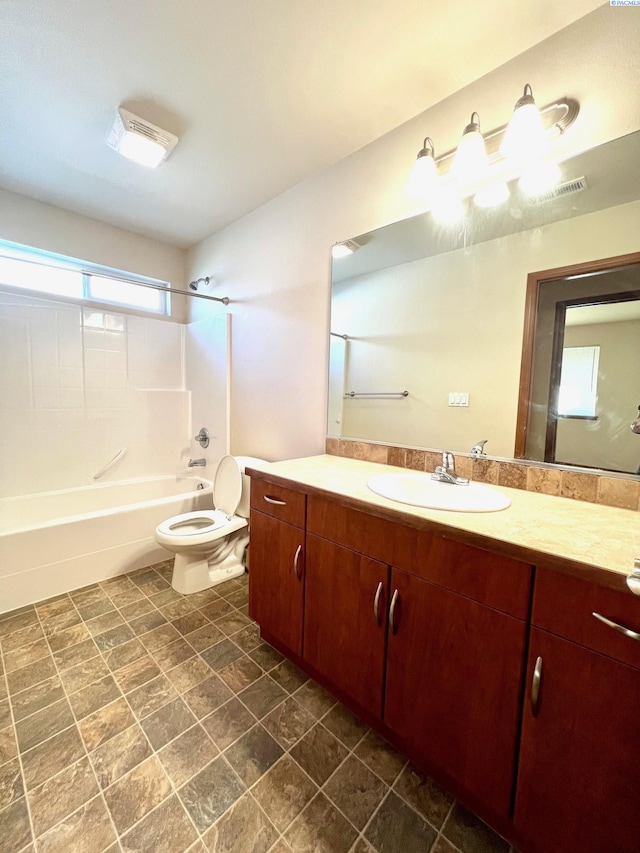 full bathroom with washtub / shower combination, vanity, and toilet