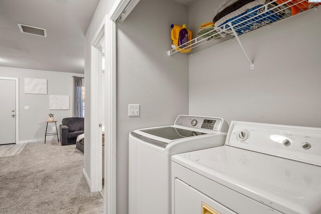 405 Whitefish Ln, Pasco, WA 99301 - clothes washing area featuring light colored carpet, independent washer and dryer, and baseboards