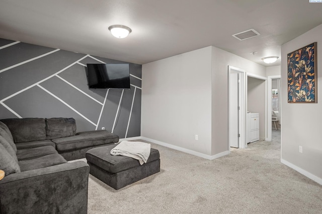 405 Whitefish Ln, Pasco, WA 99301 - carpeted living area featuring baseboards and washer / dryer