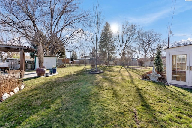 1515 Hains Ave, Richland, WA 99354 - view of yard with an outdoor structure, a fenced backyard, and a pergola