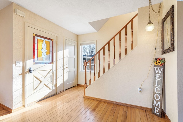 1515 Hains Ave, Richland, WA 99354 - foyer entrance featuring baseboards, stairway, hardwood / wood-style floors, and a textured wall