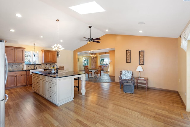 1515 Hains Ave, Richland, WA 99354 - kitchen with plenty of natural light, a breakfast bar area, a sink, and a center island