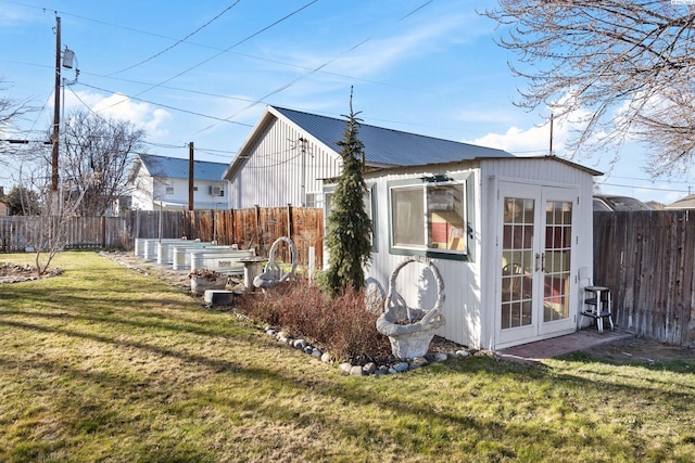 1515 Hains Ave, Richland, WA 99354 - view of outbuilding featuring french doors, an outdoor structure, and a fenced backyard