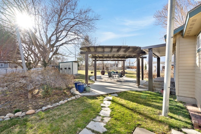 1515 Hains Ave, Richland, WA 99354 - view of yard featuring a storage shed, a patio area, fence, a pergola, and an outdoor structure