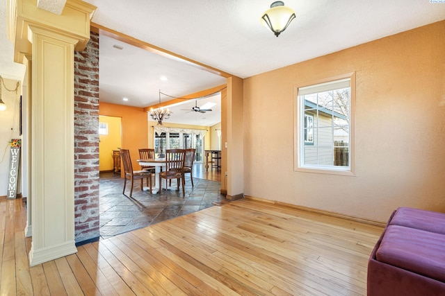 1515 Hains Ave, Richland, WA 99354 - dining area featuring ornate columns, baseboards, and light wood-style floors