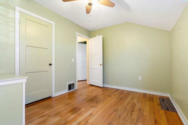 1515 Hains Ave, Richland, WA 99354 - unfurnished bedroom with vaulted ceiling, light wood finished floors, visible vents, and baseboards