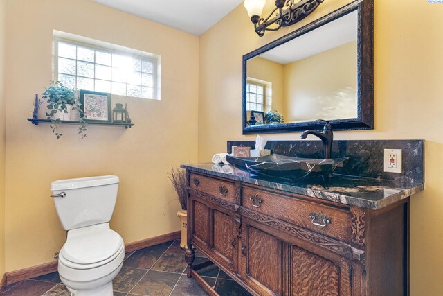 1515 Hains Ave, Richland, WA 99354 - half bathroom with stone tile floors, toilet, and baseboards