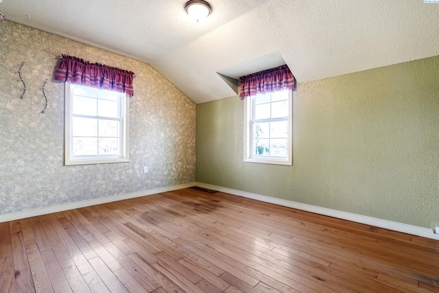 1515 Hains Ave, Richland, WA 99354 - bonus room featuring vaulted ceiling, wood-type flooring, and a healthy amount of sunlight