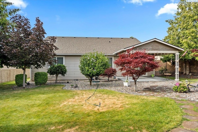 5709 W 23rd Ave, Kennewick, WA 99338 - obstructed view of property featuring a patio area and a shingled roof