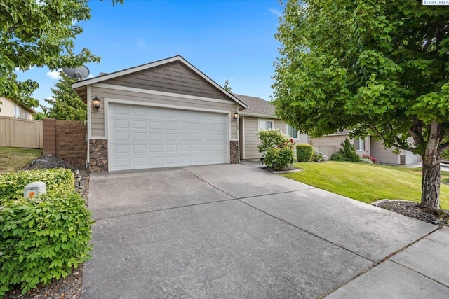 5709 W 23rd Ave, Kennewick, WA 99338 - ranch-style house with concrete driveway and stone siding