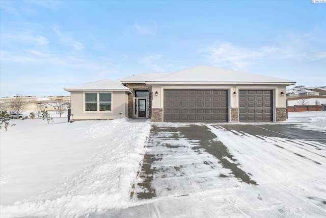 prairie-style home featuring a garage