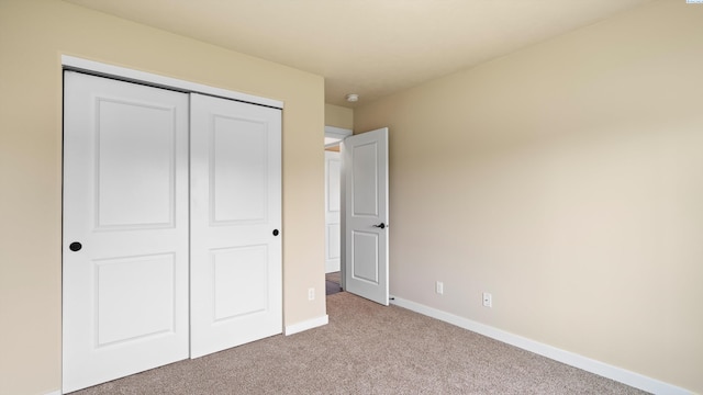 3245 S Palouse St, Kennewick, WA 99337 - unfurnished bedroom with carpet, a closet, and baseboards
