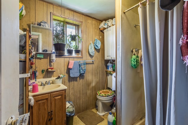full bath with a shower with curtain, wood walls, vanity, and toilet