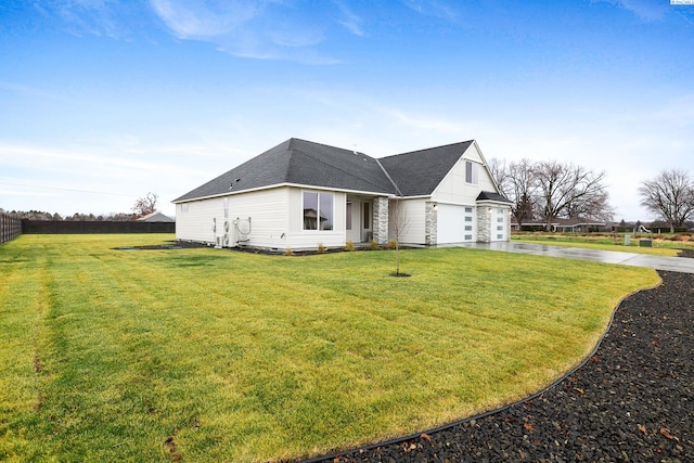 view of front facade featuring a garage and a front lawn