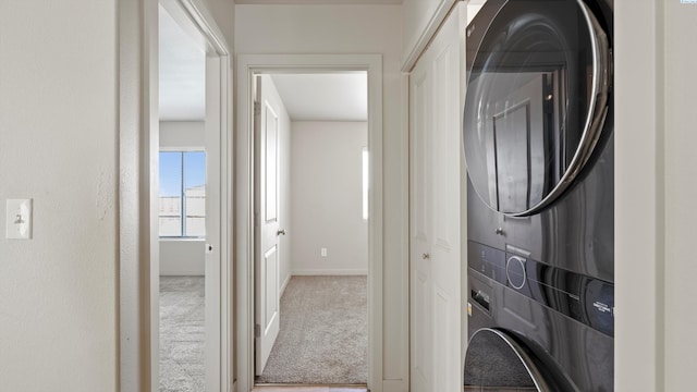 414 Whitefish Ln, Pasco, WA 99301 - washroom with stacked washer / drying machine, baseboards, and carpet flooring