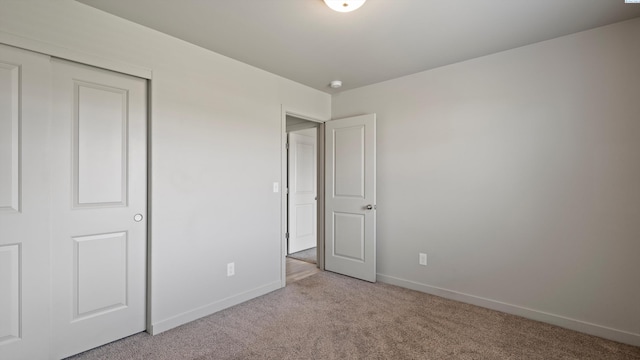 414 Whitefish Ln, Pasco, WA 99301 - unfurnished bedroom with carpet flooring, baseboards, and a closet