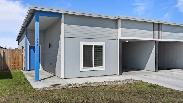 414 Whitefish Ln, Pasco, WA 99301 - back of property featuring a patio and a carport