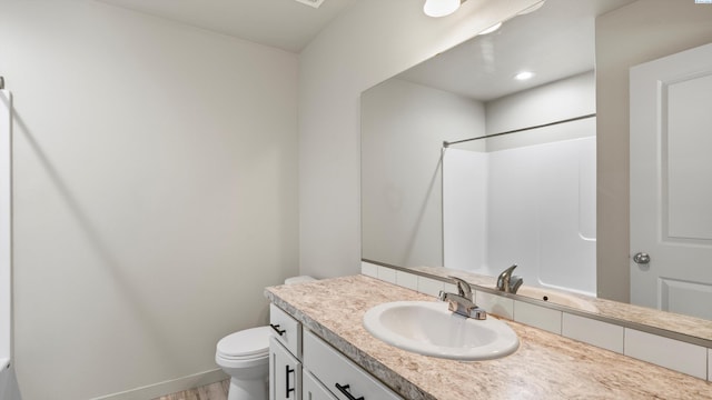 414 Whitefish Ln, Pasco, WA 99301 - full bathroom featuring toilet, vanity, and a shower