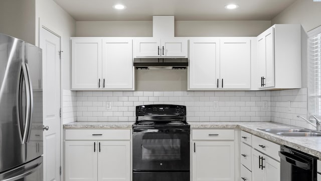 414 Whitefish Ln, Pasco, WA 99301 - kitchen with black appliances, under cabinet range hood, a sink, white cabinetry, and tasteful backsplash