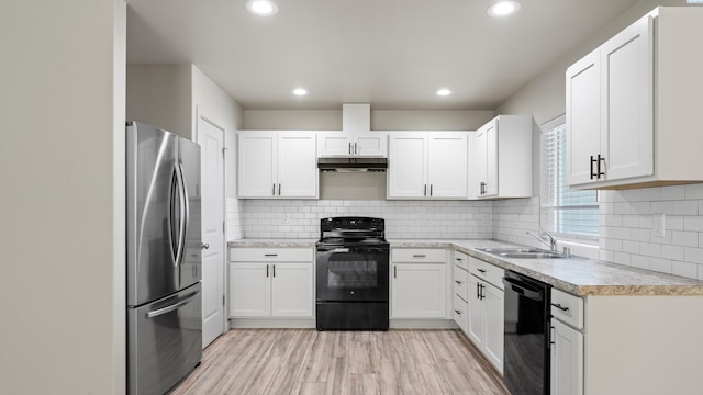 414 Whitefish Ln, Pasco, WA 99301 - kitchen with black appliances, a sink, under cabinet range hood, light countertops, and light wood-style floors