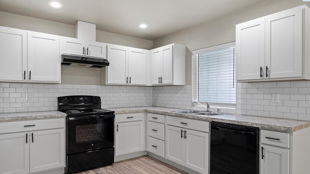 414 Whitefish Ln, Pasco, WA 99301 - kitchen featuring black appliances, under cabinet range hood, a sink, light wood-type flooring, and white cabinetry