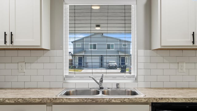 414 Whitefish Ln, Pasco, WA 99301 - kitchen with a sink, black dishwasher, white cabinets, and light countertops