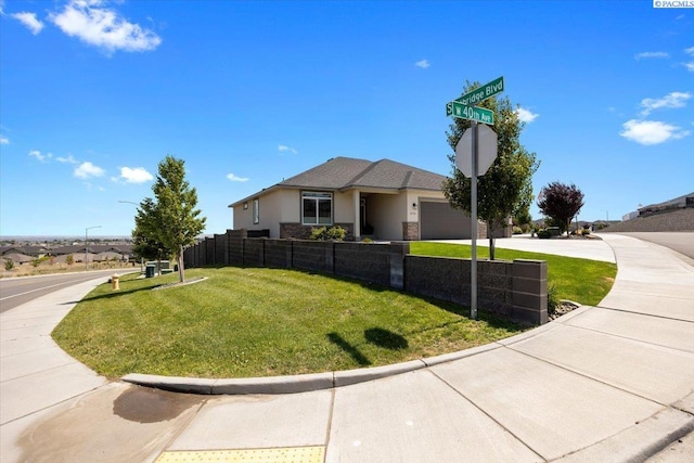 5770 W 40th Ave, Kennewick, WA 99338 - view of front of home with a garage, concrete driveway, and stucco siding