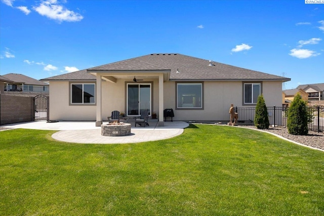 5770 W 40th Ave, Kennewick, WA 99338 - rear view of property featuring an outdoor fire pit, a patio, a gate, a shingled roof, and ceiling fan