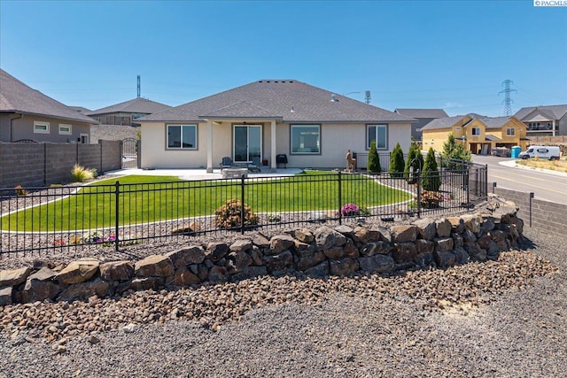 5770 W 40th Ave, Kennewick, WA 99338 - back of house featuring a fenced backyard, a patio, stucco siding, and a shingled roof