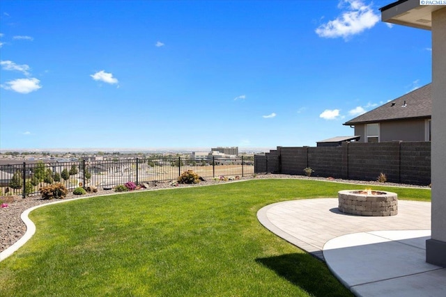 5770 W 40th Ave, Kennewick, WA 99338 - fenced backyard featuring a fire pit and a patio