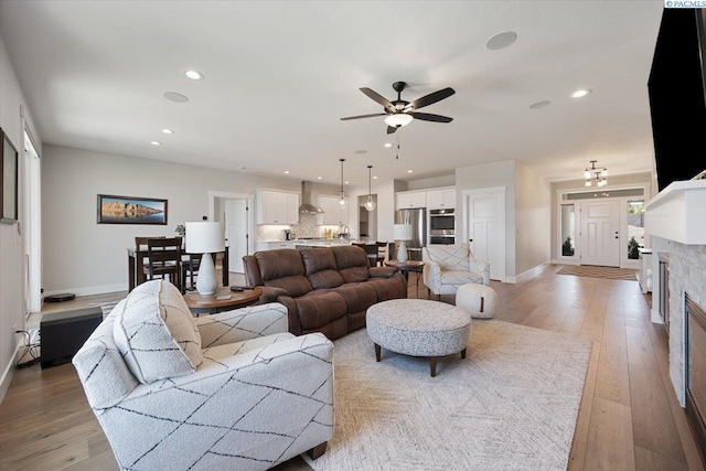 5770 W 40th Ave, Kennewick, WA 99338 - living room featuring light wood-style floors, a ceiling fan, and recessed lighting