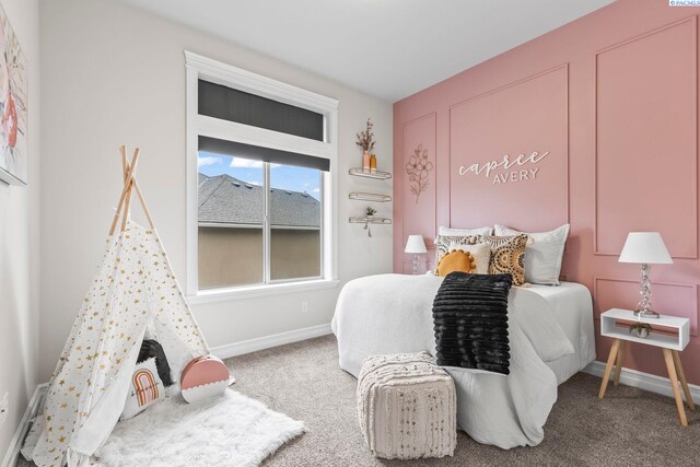 carpeted bedroom with baseboards