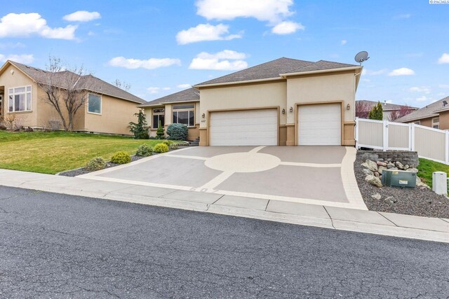 view of front of home featuring fence, an attached garage, concrete driveway, a front lawn, and stucco siding