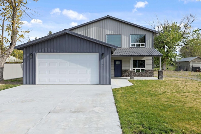 view of front of home featuring a garage and a front lawn