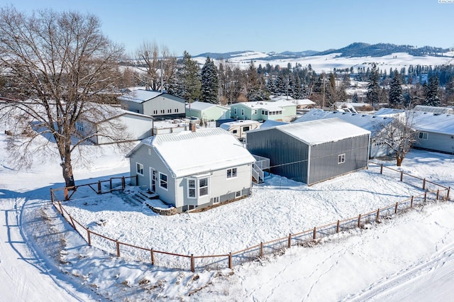 snowy aerial view featuring a mountain view