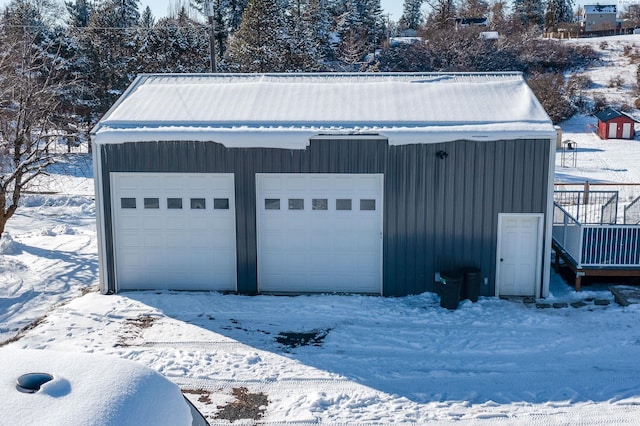 view of snow covered garage