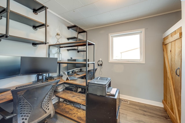 office space featuring crown molding and wood-type flooring