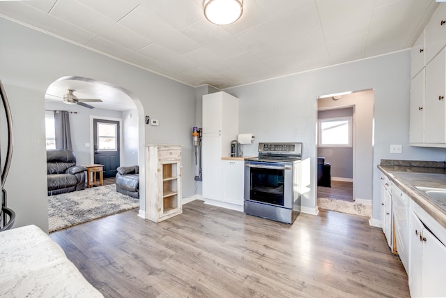 kitchen with white cabinetry, electric range, ceiling fan, and light wood-type flooring