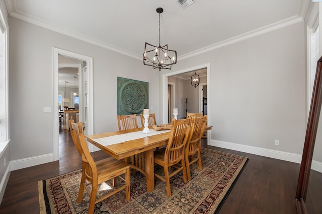 1016 SE Crestlane Dr, College Place, WA 99324 - dining space with baseboards, a chandelier, crown molding, dark wood-type flooring, and visible vents