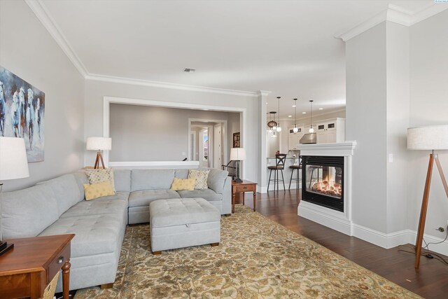 1016 SE Crestlane Dr, College Place, WA 99324 - living area with ornamental molding, baseboards, a multi sided fireplace, and dark wood finished floors