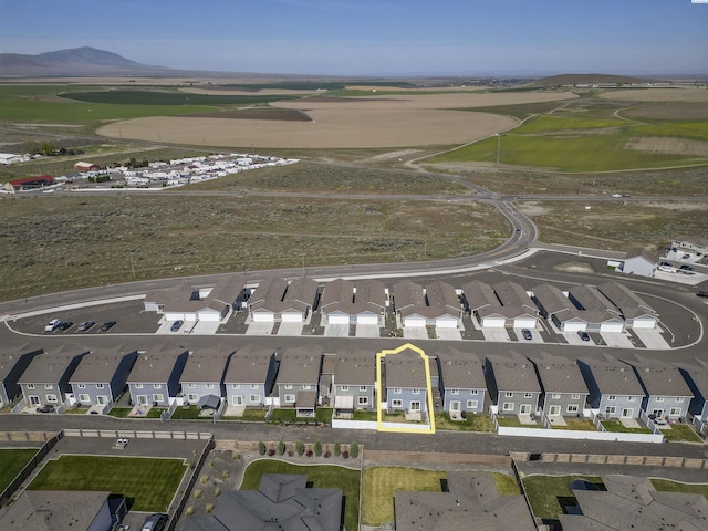 birds eye view of property with a mountain view and a residential view
