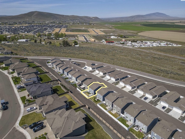 drone / aerial view featuring a mountain view and a residential view