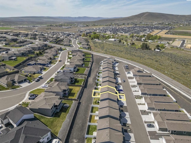 aerial view featuring a mountain view and a residential view