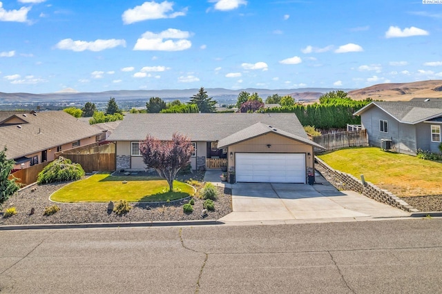 602 N 57th St, Yakima, WA 98901 - ranch-style home featuring an attached garage, driveway, and a mountain view